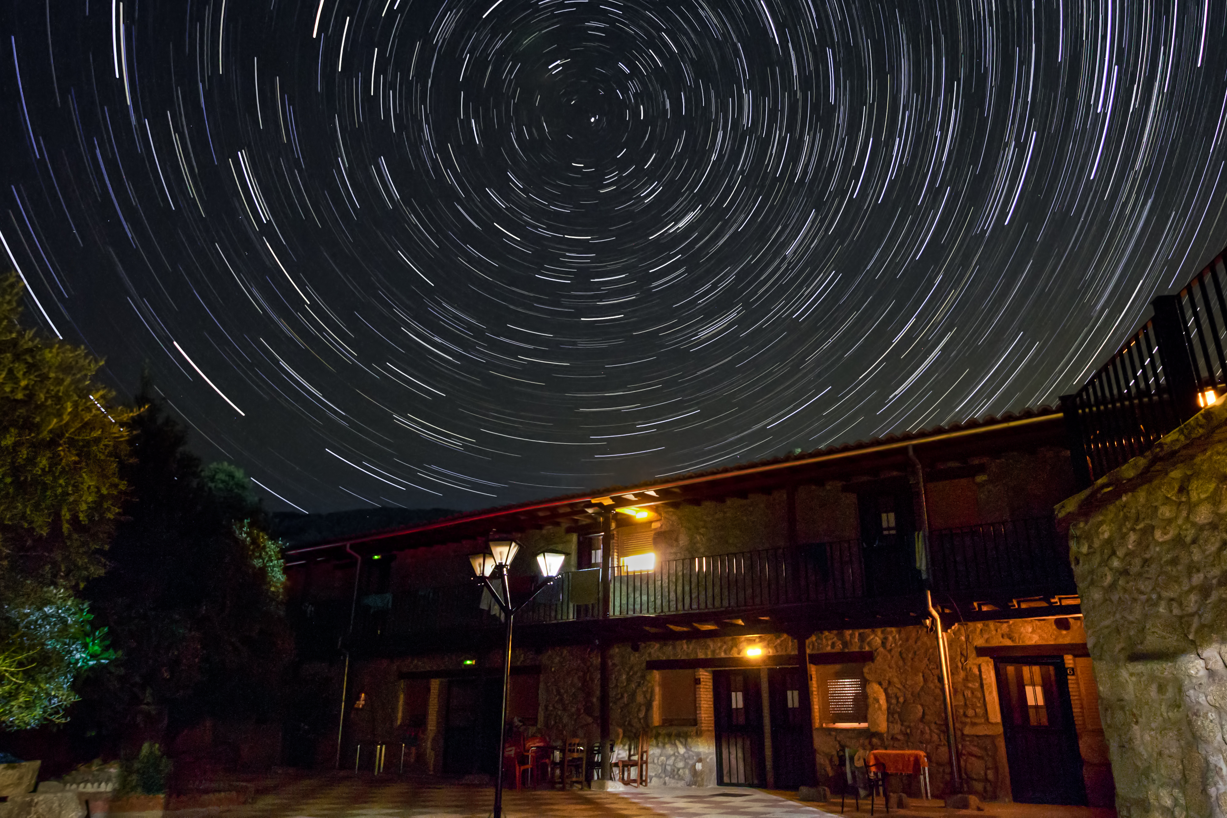 Star trails above a camphouse.