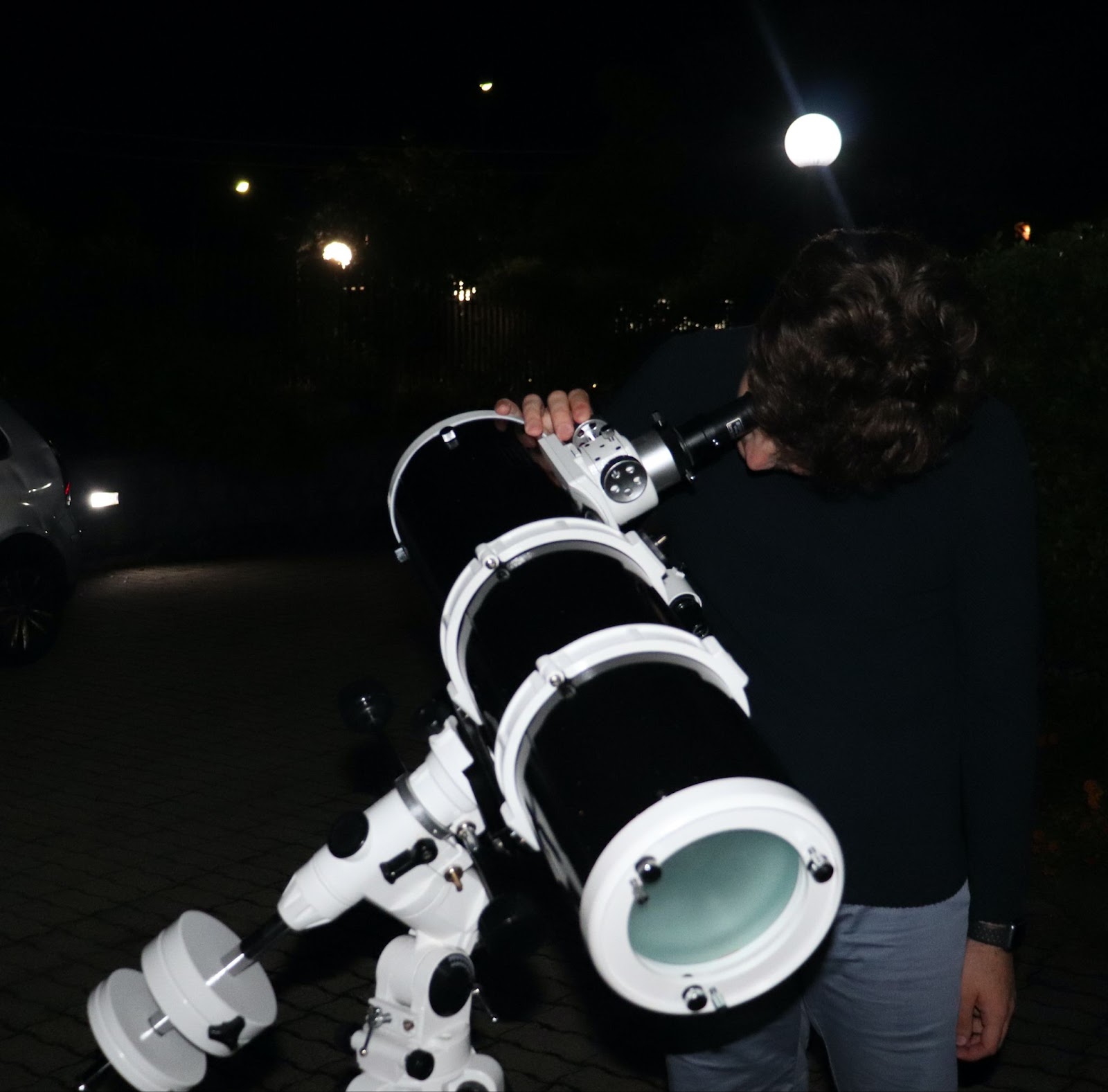 A participant looking through a telescope.