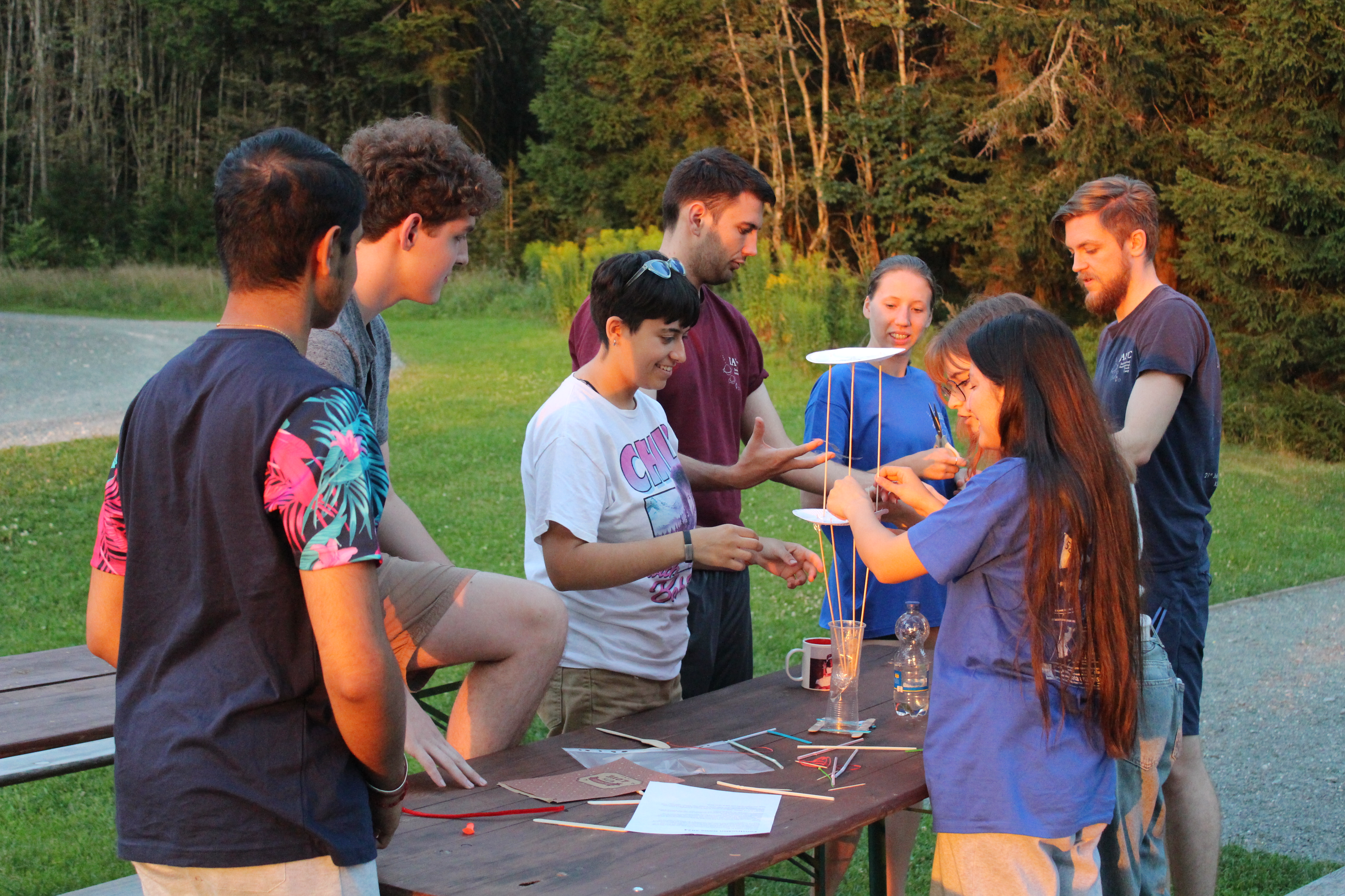 Participants building something out of craft supplies.